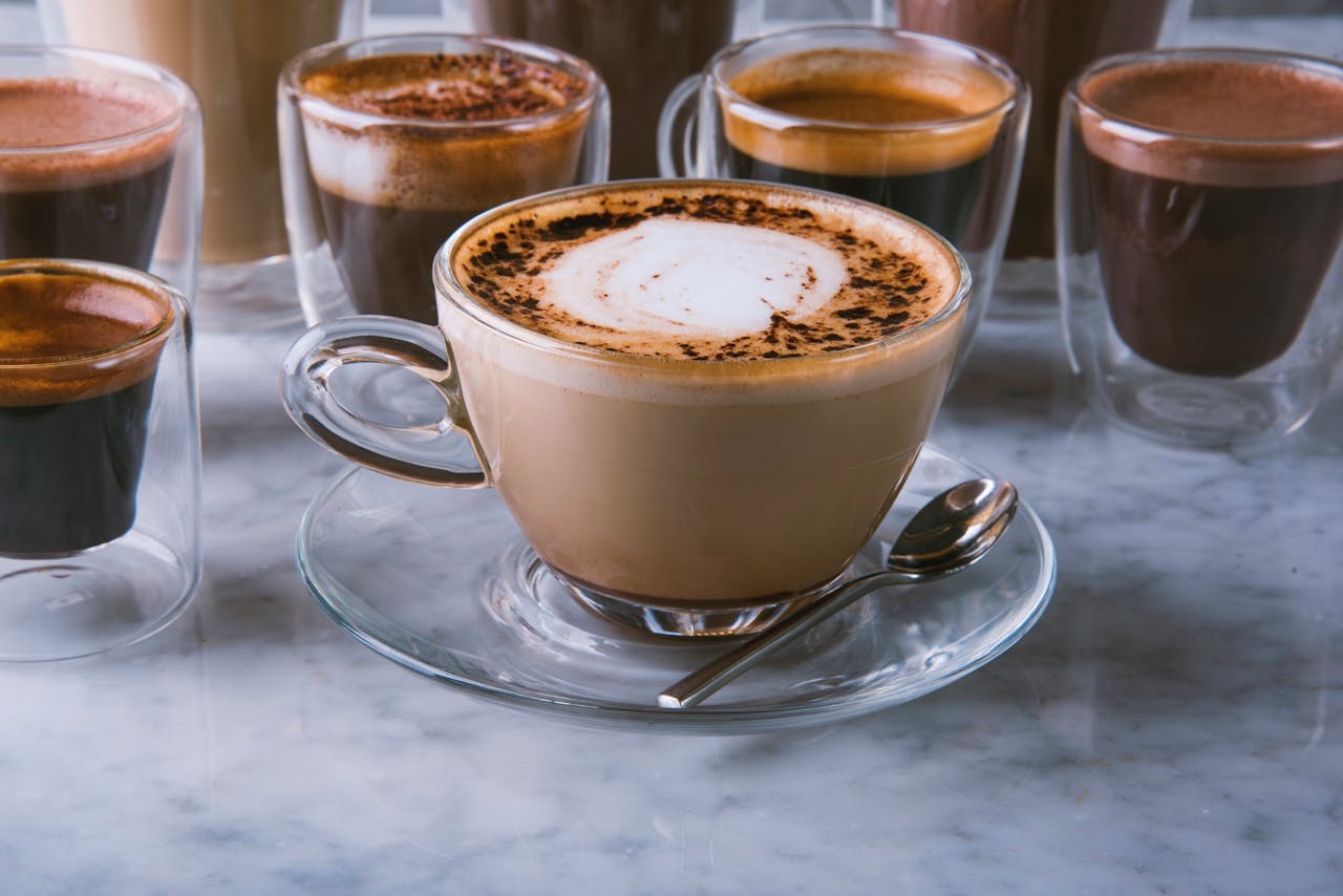 Mastering the First Impression: Your intriguing post title goes here A variety of coffee drinks on a marble table in a Riyadh cafe, perfect for coffee enthusiasts.